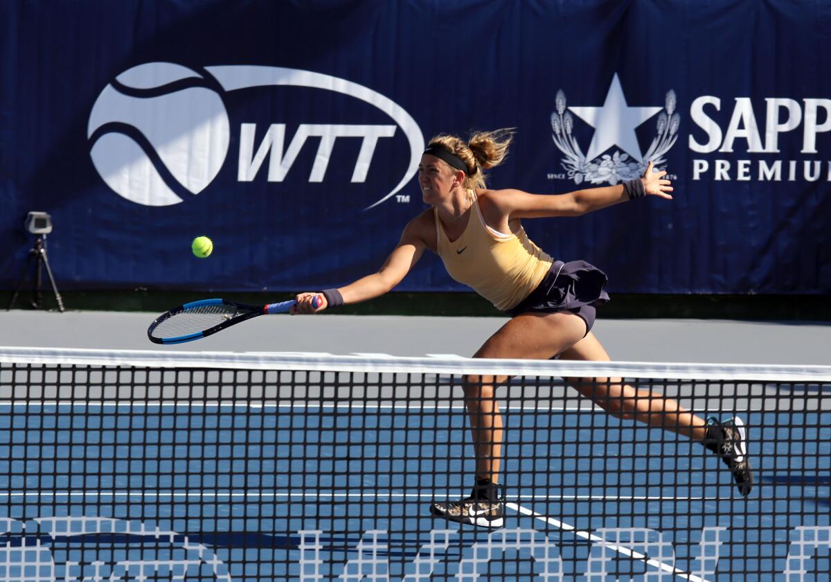 Victoria Azarenka, playing for the Orange County Breakers, returns a serve in the women's singles match against the San Diego Aviators in Saturday's World Team Tennis match at the Palisades Tennis Club in Newport Beach.