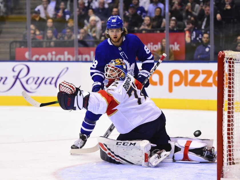 Toronto Maple Leafs right wing William Nylander (88) watches the puck get past Florida Panthers goaltender Sergei Bobrovsky (72) during the second period of an NHL hockey game, Monday, Feb. 3, 2020 in Toronto. (Frank Gunn/The Canadian Press via AP)
