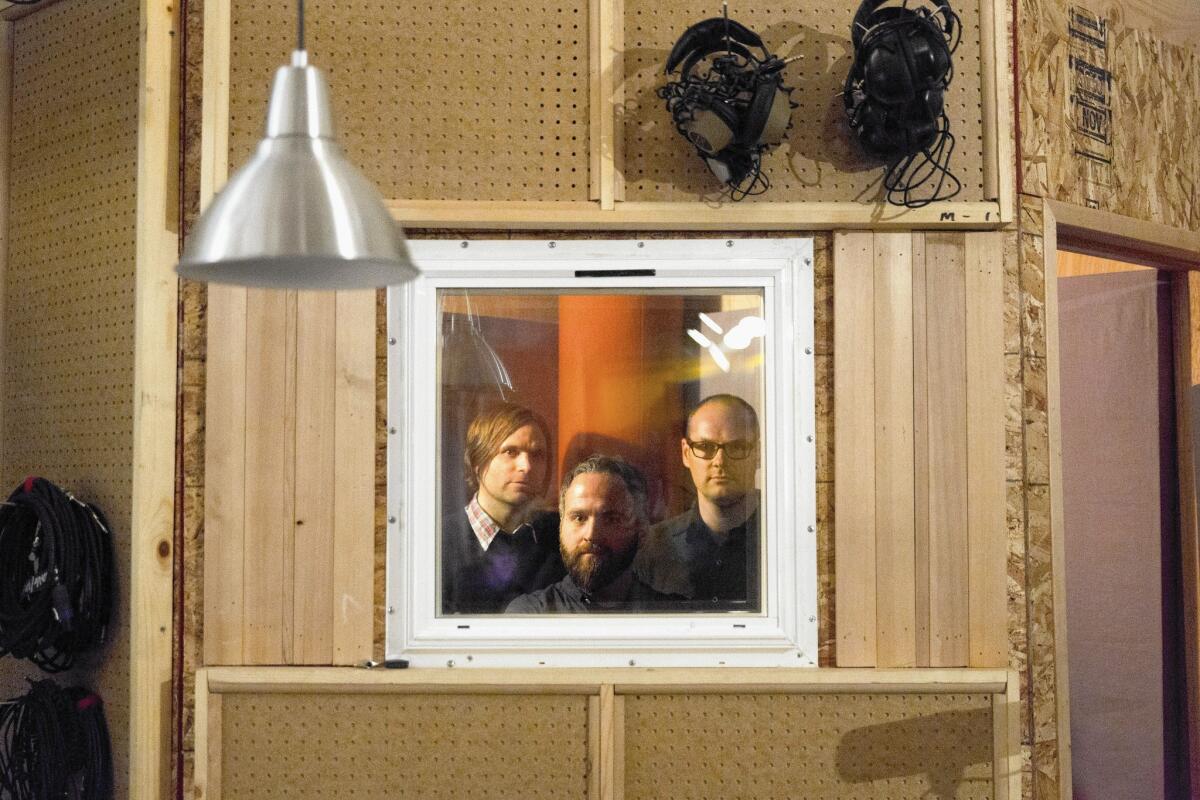 Death Cab for Cutie frontman Ben Gibbard, left, with bandmates Nick Harmer, center, and Jason McGerr. Gibbard says that in writing the group's new album, "Kintsugi" he wasn't interested in creating "a tell-all or a kiss-off or anything like that."
