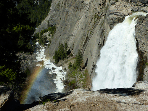 A rainbow next to Illilouette Fall, seen from a turnout on the Panorama Trail out of Glacier Point. The beauty of this waterfall is its seclusion  it is not visible from any road and can only be seen from a steep hiking trail.