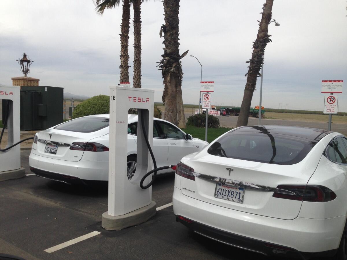 Tesla Model S sedans at the Harris Ranch supercharging station on Interstate 5.