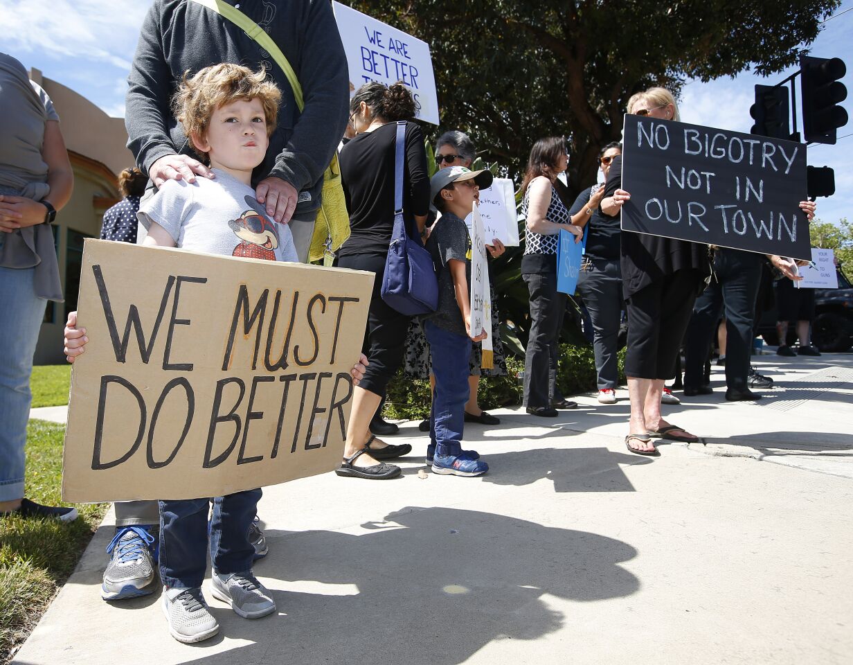 Brady Fox, 4, with his dad Kyle attend a rally not far from the Chabad of Poway, where a deadly shooting took place the day before on April 28, 2019 in Poway, California. (Photo by K.C. Alfred/The San Diego Union-Tribune)