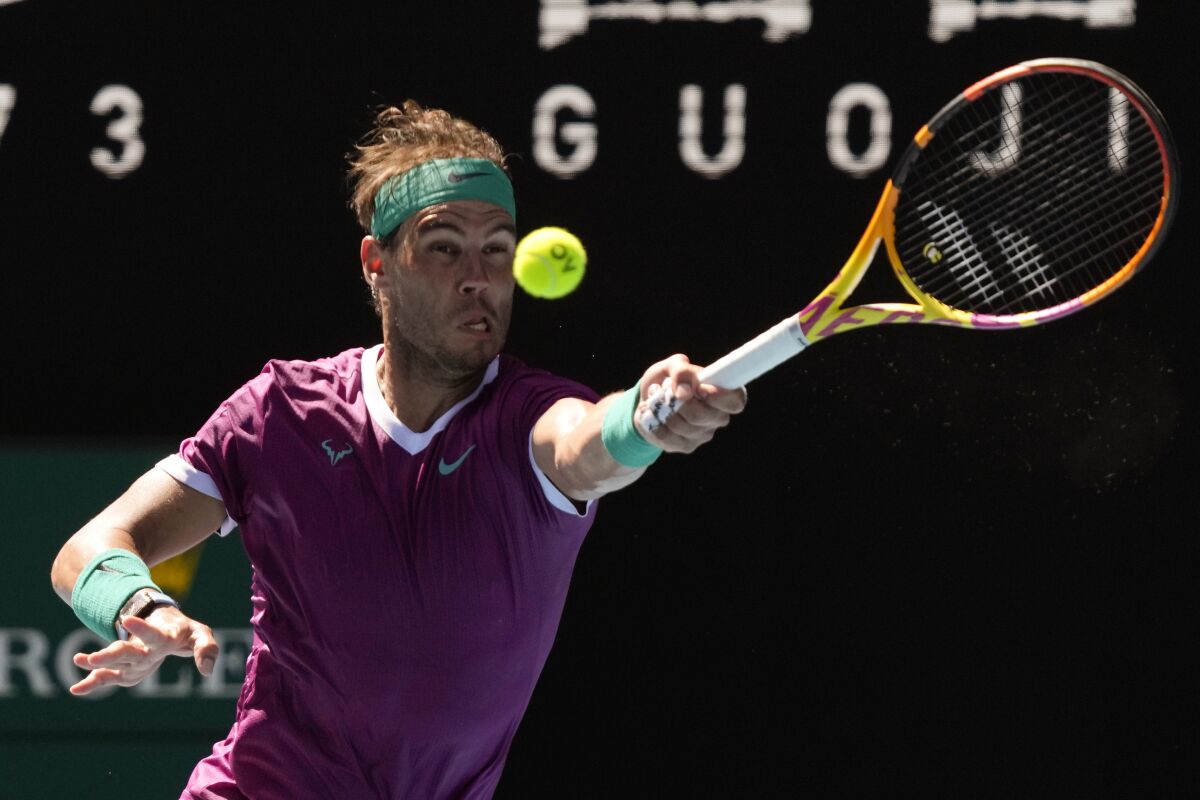 Rafael Nadal hits a forehand return during his fourth-round victory over Adrian Mannarino at the Australian Open.