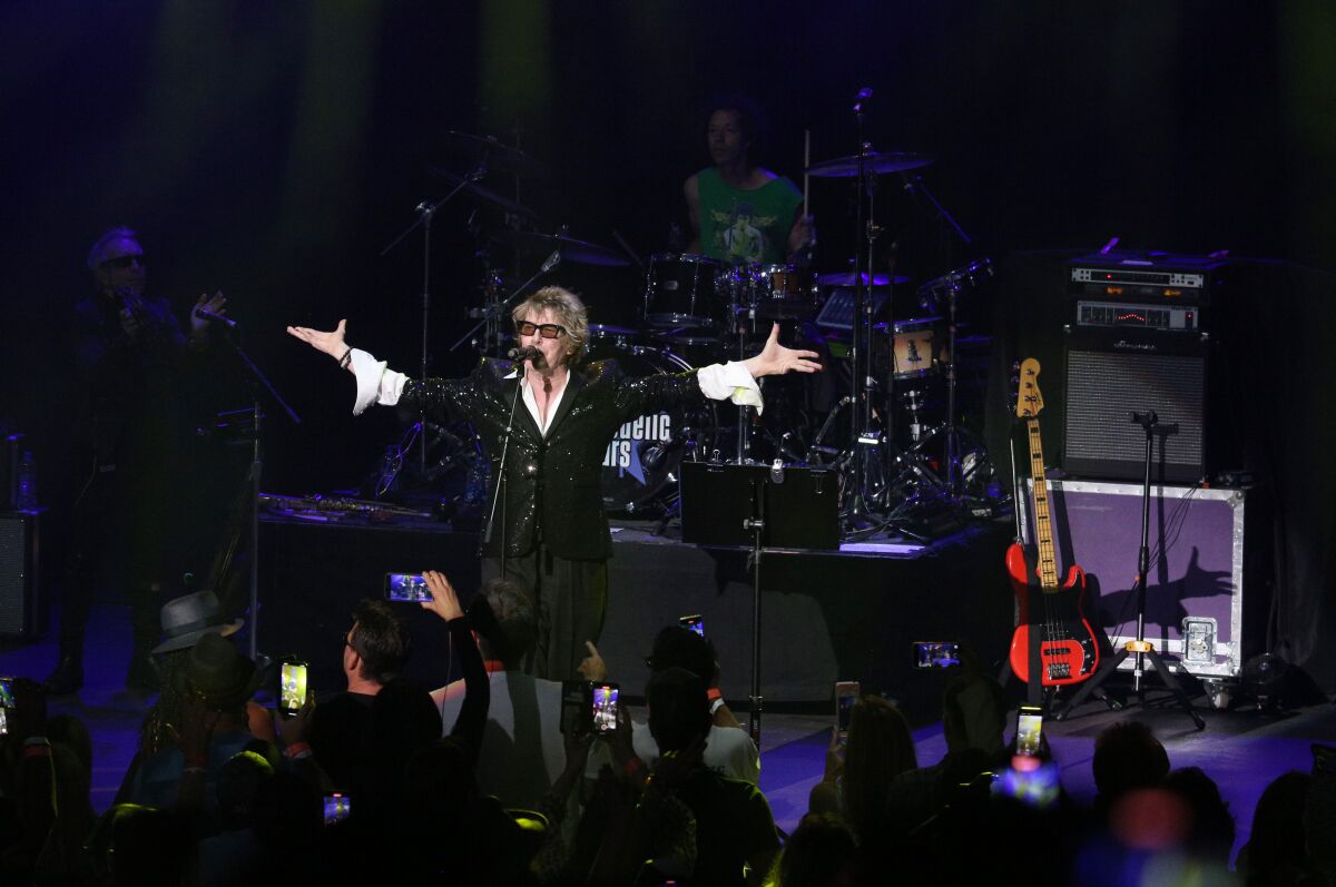 Psychedelic Furs frontman Richard Butler gestures to the crowd.