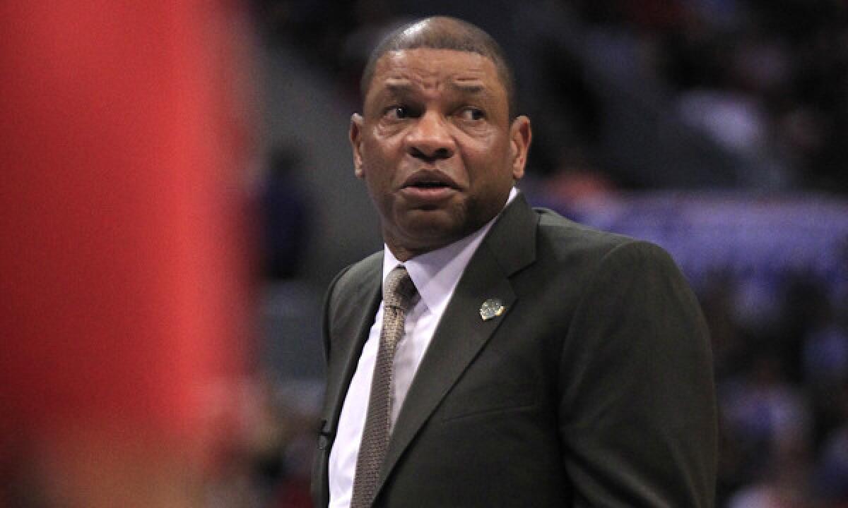 Clippers Coach Doc Rivers questions a call during the team's 113-107 loss to the Dallas Mavericks at Staples Center on Thursday. Rivers says the Clippers will discover their true capabilities once the playoffs start.