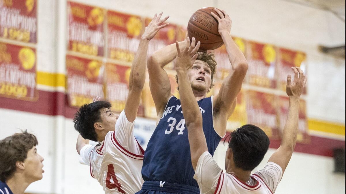 Newport Harbor High's Dayne Chalmers, shown going up for a shot at Loara on Nov. 27, led the Sailors to a 66-57 win against Fountain Valley on Wednesday.