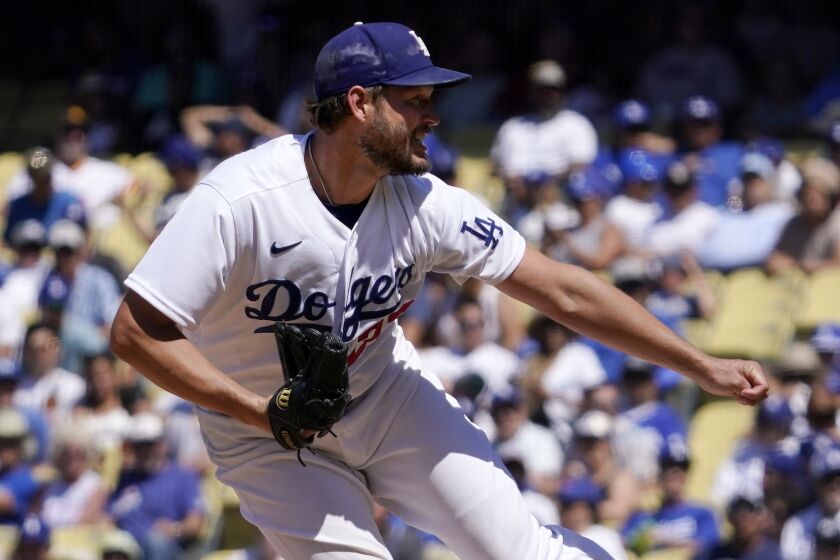 Los Angeles Dodgers starting pitcher Clayton Kershaw throws to the plate during the seventh inning.