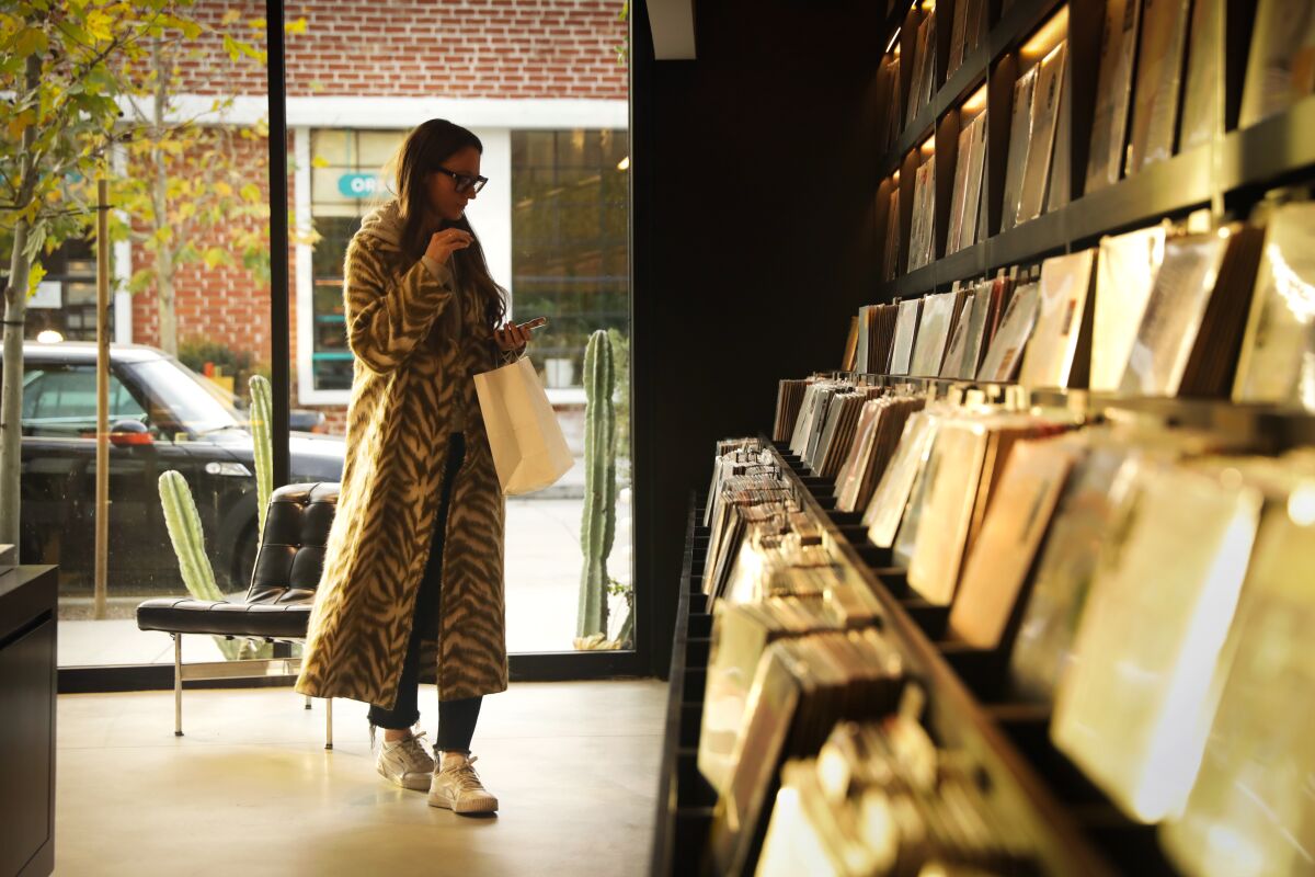 A customer browses inside Supervinyl record shop on Sycamore Avenue in Hollywood.
