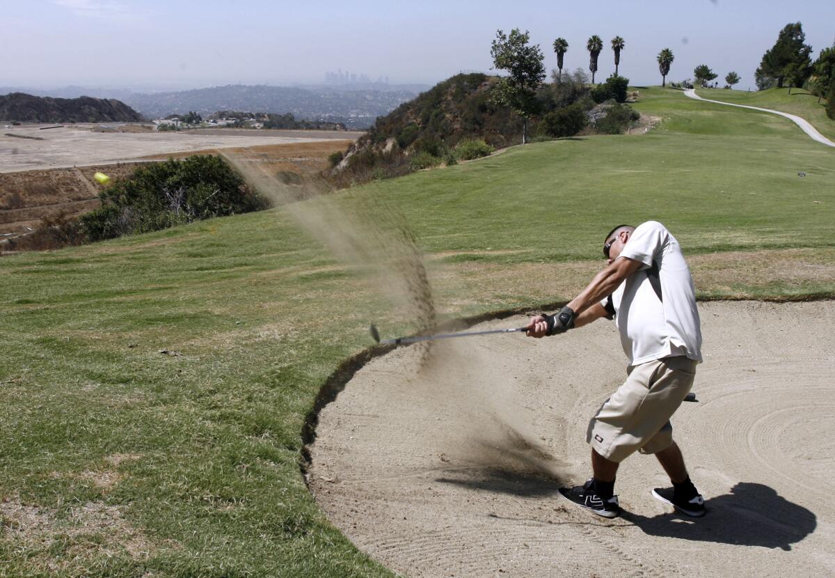 Alex Alcala, 30, of Baldwin Park, gets out of the sand trap during the Inaugural Glendale City Golf Championship held at Scholl Canyon Golf Course in Glendale on Wednesday, August 22, 2012.