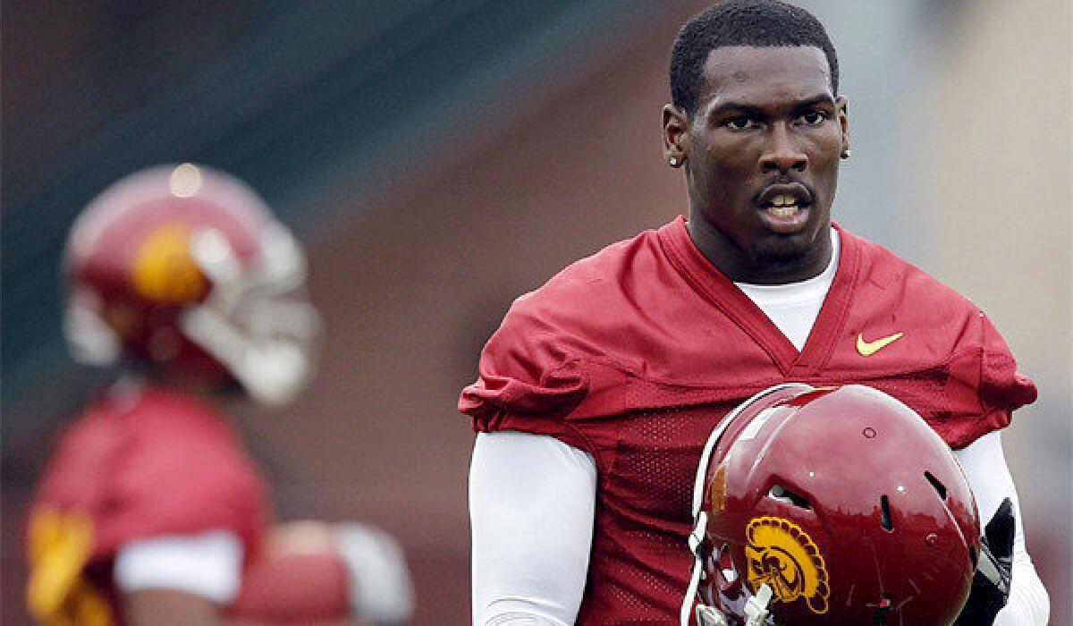 USC receiver Marqise Lee, out with a knee sprain, says he will be back for Notre Dame.