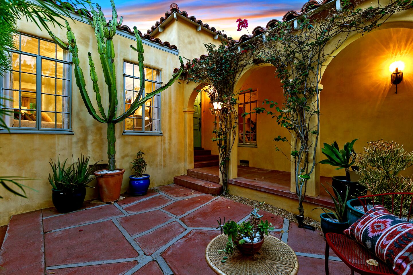 A secluded courtyard sits at the entryway of the house.