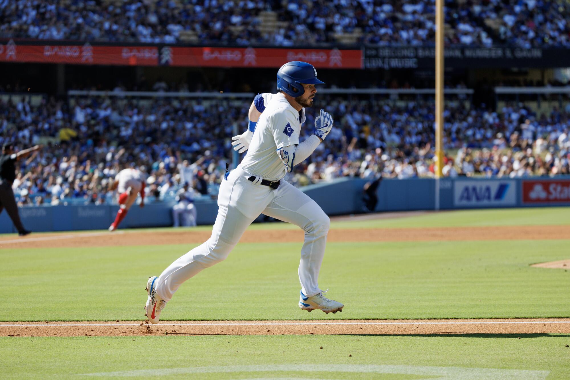 Gavin Lux sprints after hitting a double in the Dodgers' 9-6 win over the Boston Red Sox at Dodger Stadium.