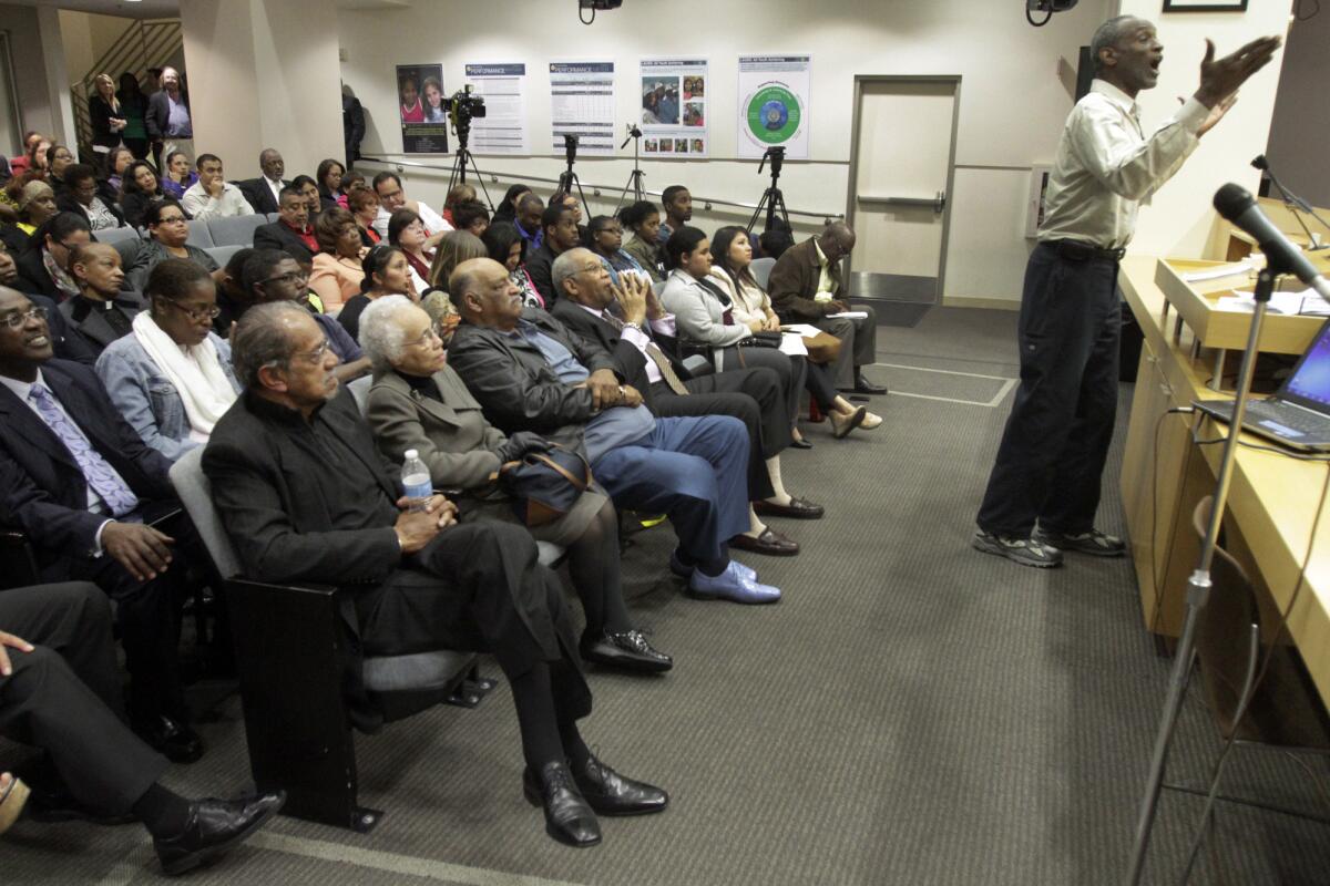 Community activist Morris Griffin, right, voices his support for the appointment of Dr. George McKenna to replace Marguerite LaMotte at the Los Angeles Board of Education district headquarters this month.