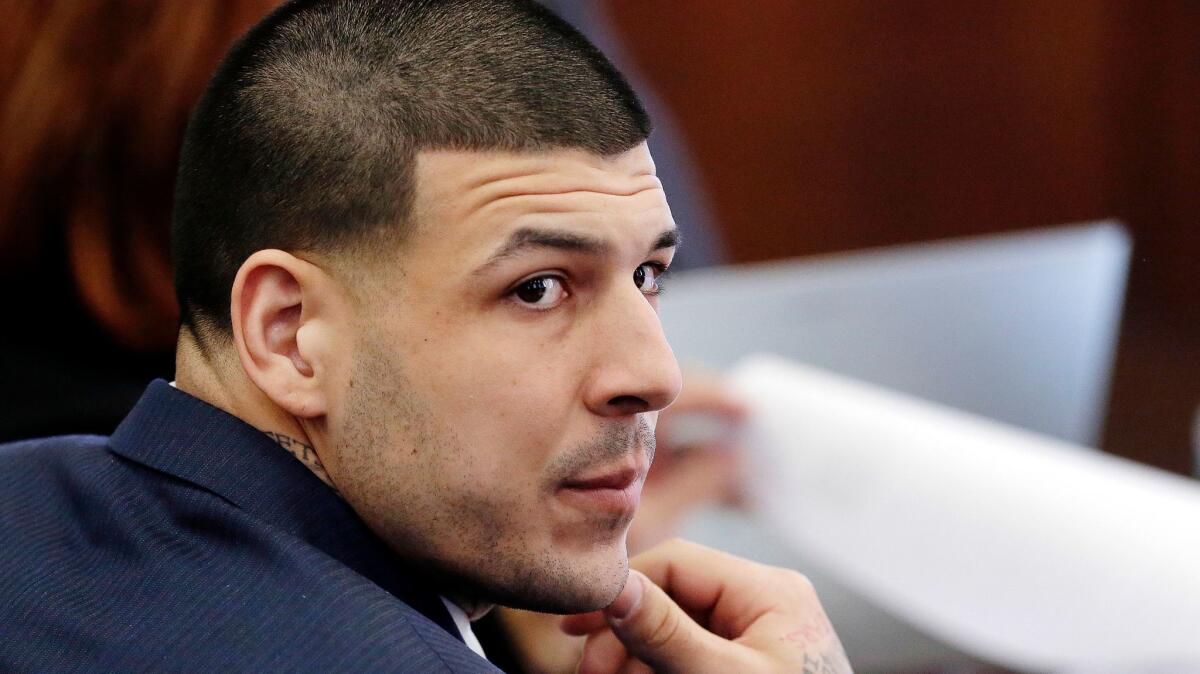 Aaron Hernandez listens during his double murder trial in Suffolk Superior Court on March 15.