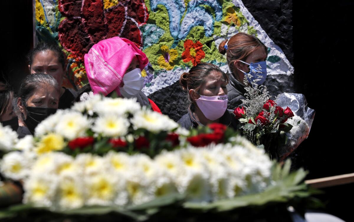 Relatives wait their turn to enter the San Nicolás Tolentino cemetery in the Mexico City neighborhood of Ixtapalapa for the funeral of their loved one on April 30, 2020.