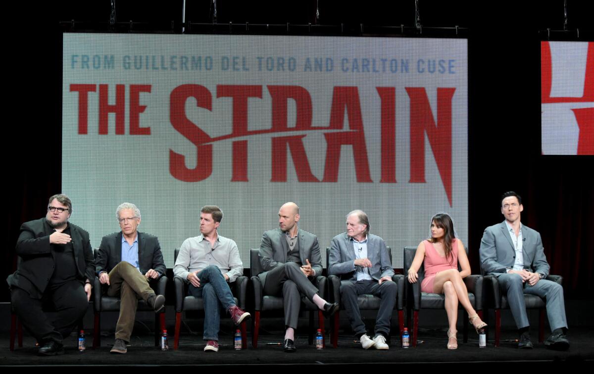 Guillermo del Toro, left, Carlton Cuse, Chuck Hogan, Corey Stoll, David Bradley, Mia Maestro and Kevin Durand at "The Strain" panel during FX's TCA presentation.