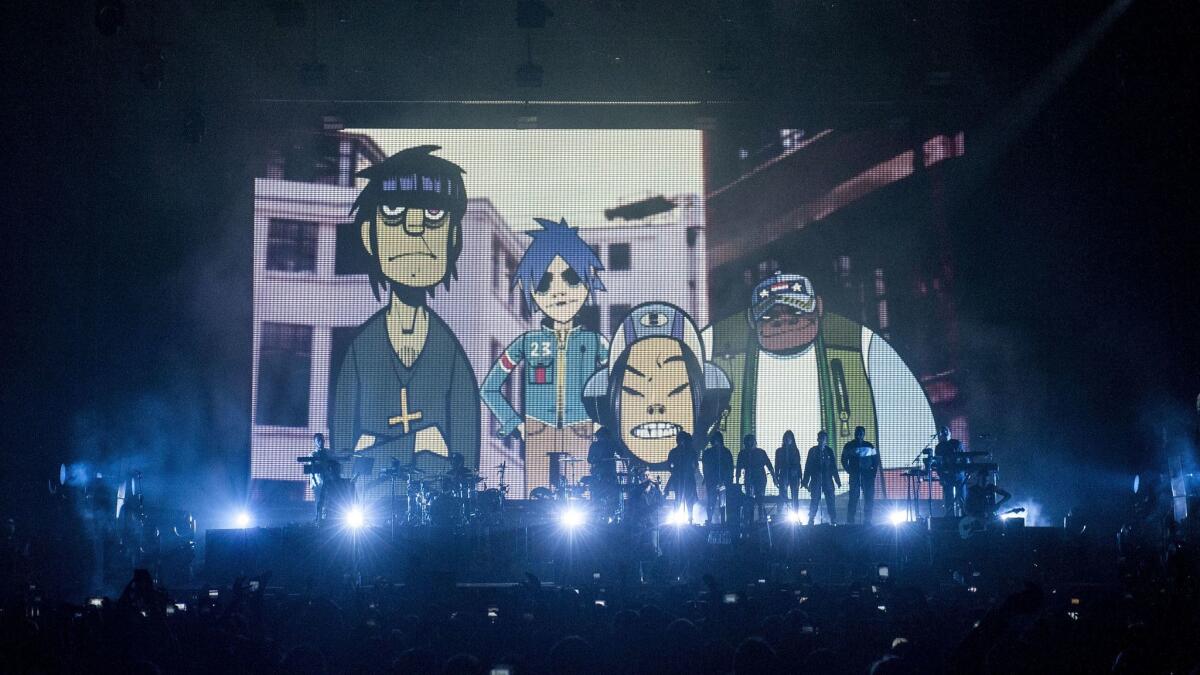 The concert featured videos projected on a large screen at the back of the stage.