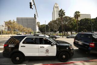 LOS ANGELES, CA - OCTOBER 09, 2019 A LAPD vehicle parked on 1st Street at Spring Street as the LAPD is increasing patrols around the Civic Center area because government employees have raised concerns about the homeless population in the area. (Al Seib / Los Angeles Times)