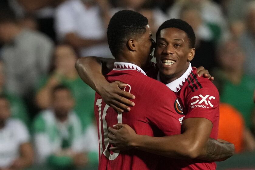 Manchester United's Anthony Martial, right, celebrates after scoring his side's second goal with his teammate Marcus Rashford during the Europa League group E soccer match between Omonia and Manchester United at GSP stadium in Nicosia, Cyprus, Thursday, Oct. 6, 2022. (AP Photo/Petros Karadjias)