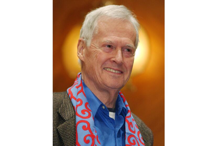 FILE - American composer Ned Rorem appears at the Curtis Institute of Music in Philadelphia after a dress rehearsal for his "Evidence of Things Not Seen" on Oct. 23, 2003. Rorem, the prolific Pulitzer- and Grammy prize-winning musician known for his vast output of compositions and for his barbed and sometimes scandalous prose, died Friday at 99. (AP Photo/Jessica Griffin, File)