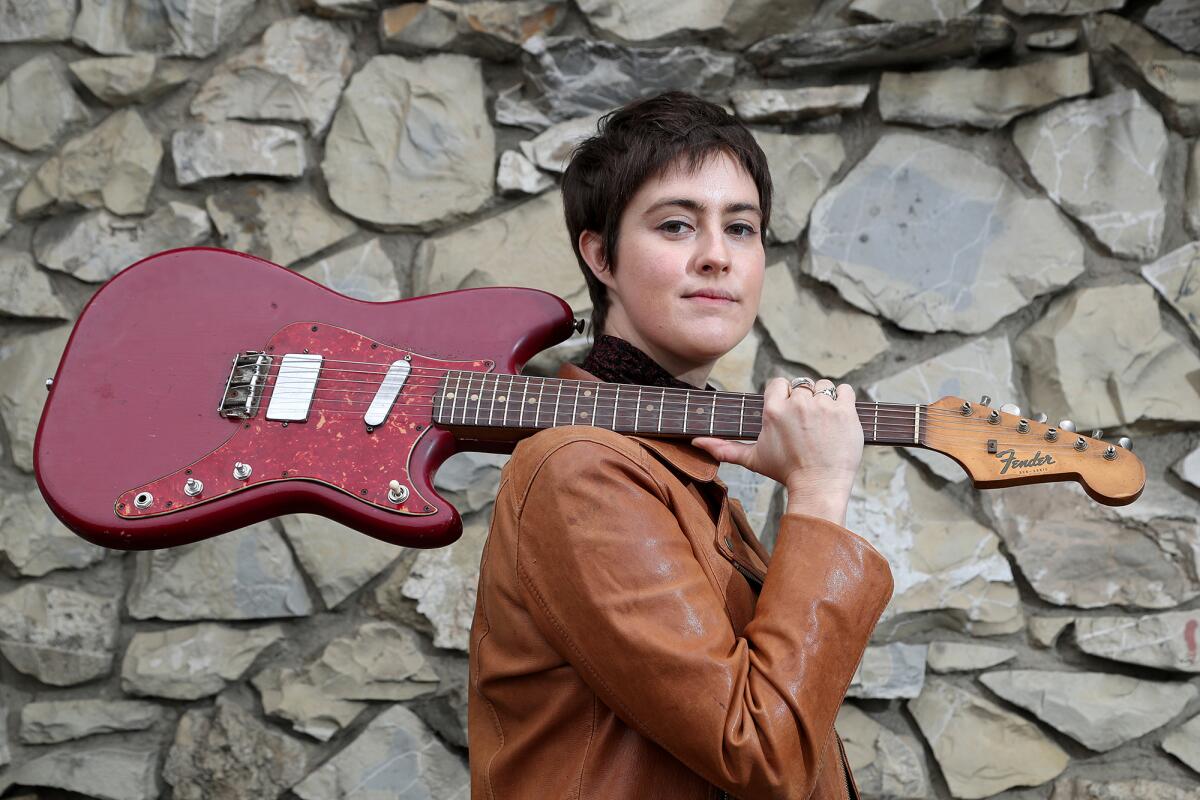 Ali Coyle, 32, a Santa Ana-based singer and songwriter, poses for a portrait at the Wayfarer