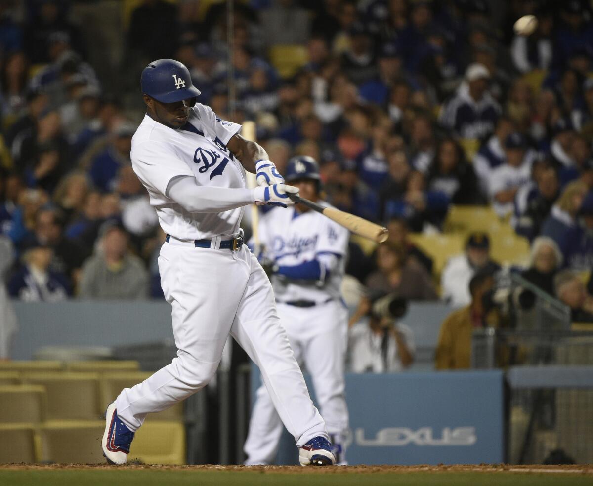Dodgers outfielder Yasiel Puig hits a home run during the fourth inning of a game against the Miami Marlins on April 25.