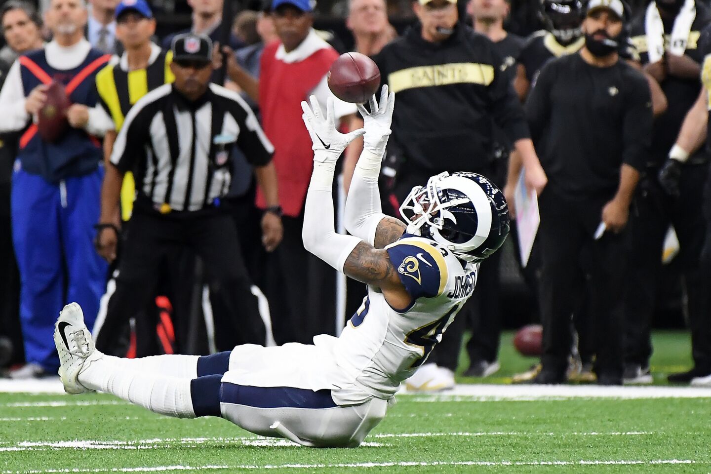 Rams safety John Johnson intercepts the ball in overtime agianst the New Orleans Saints in the NFC Championship at the Superdome in New Orleans Sunday.