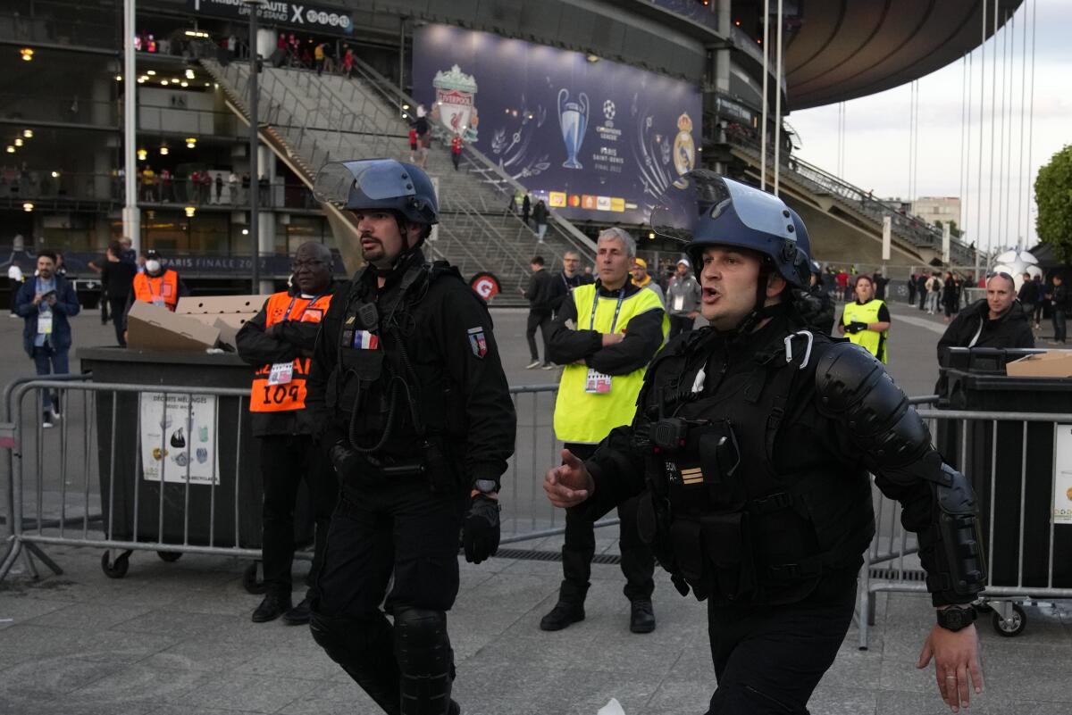 Police officers guard the Stade de France before the Champions League final May 28, 2022. 