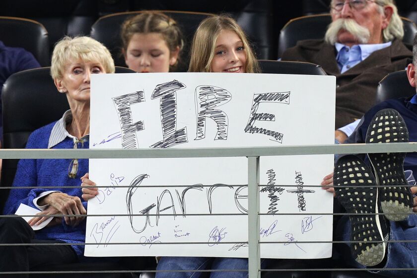 ARLINGTON, TEXAS - NOVEMBER 28: A fan holds a sign that reads "Fire Garrett" in the fourth quarter of a game between the Dallas Cowboys and the Buffalo Bills at AT&T Stadium on November 28, 2019 in Arlington, Texas. (Photo by Richard Rodriguez/Getty Images) ** OUTS - ELSENT, FPG, CM - OUTS * NM, PH, VA if sourced by CT, LA or MoD **