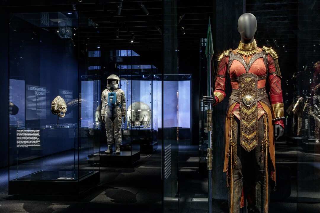 The costume worn by Danai Gurira in "Black Panther" and a spacesuit from "2001: A Space Odyssey" at the Academy Museum.