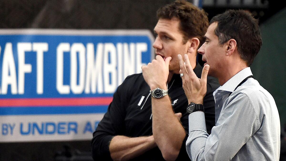 Lakers GM Rob Pelinka, right, chats with coach Luke Walton at the NBA draft combine on Friday at Quest MultiSport Complex in Chicago.