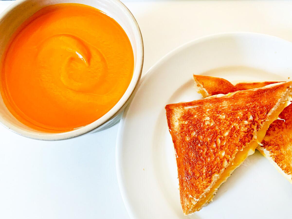 Homemade tomato soup and a grilled cheese sandwich