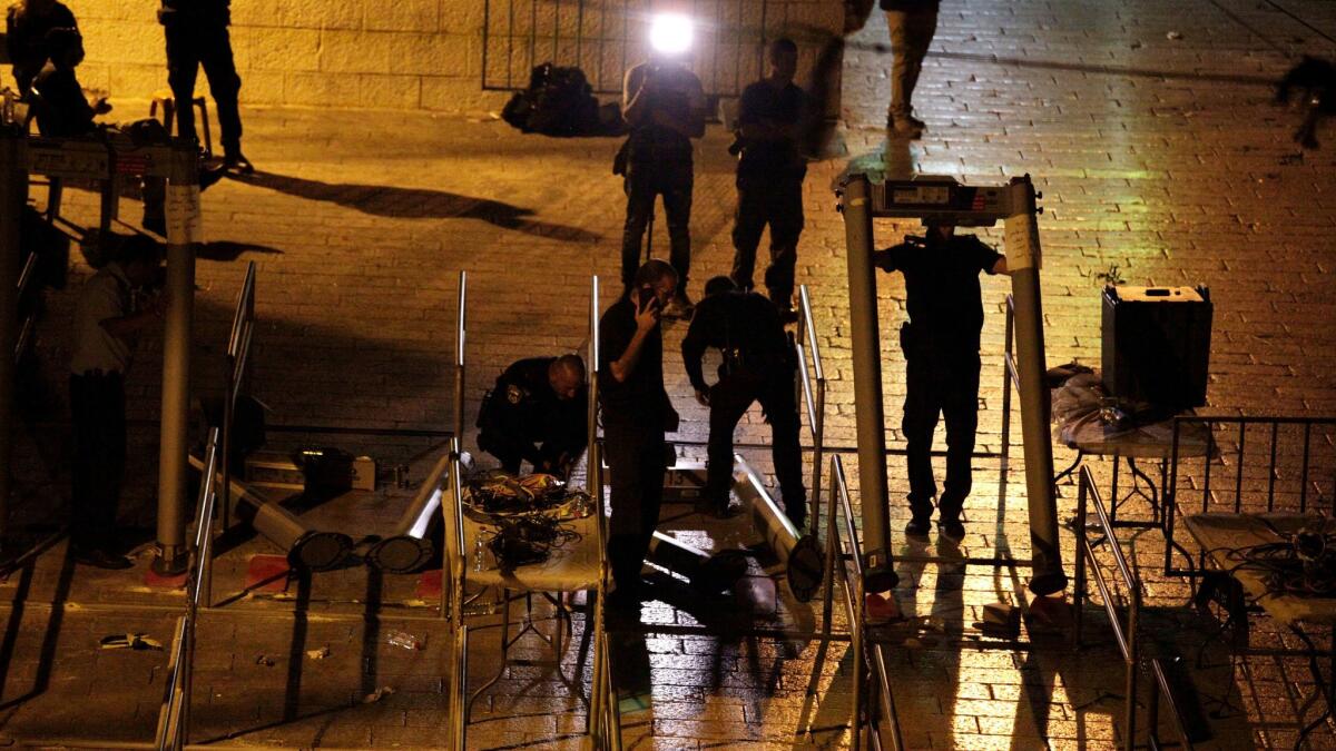 Israeli police dismantle metal detectors outside Al Aqsa Mosque compound in Jerusalem's Old City on July 25, 2017.