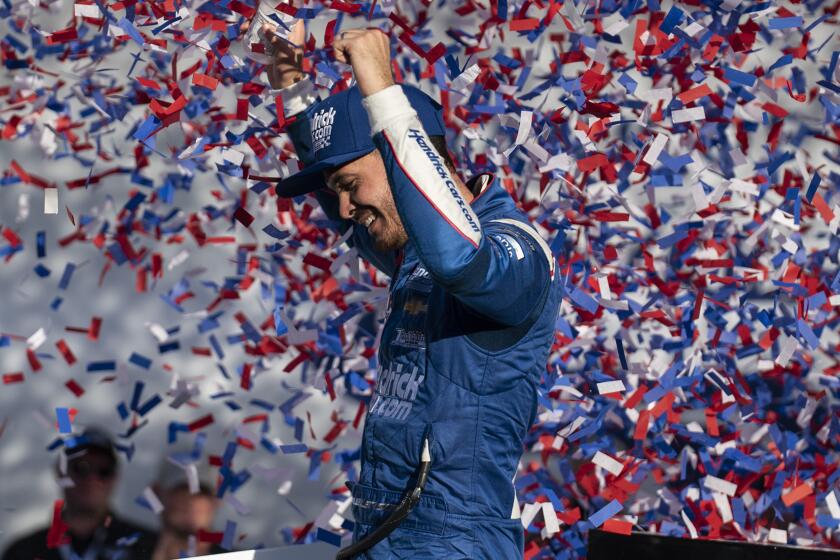 Kyle Larson celebrates in Victory Lane after winning a NASCAR Cup Series auto racing.