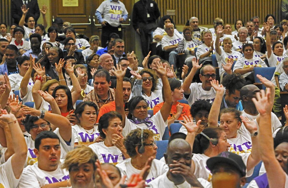 People at a Los Angeles County Board of Supervisors meeting show their support for providing a drug that can prevent HIV infections.