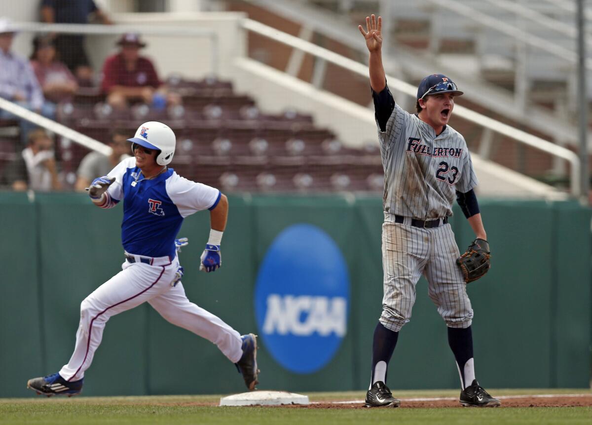Cal State Fullerton infielder Jake Pavletich (23) calls for the ball while Louisiana Tech's Jordan Washam, left, rounds third base on his way to scoring a run during the Starkville Regional.