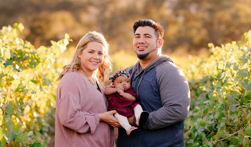 Michael Hunter, vice chairman of the Jamul Indian Village tribe, with his wife Heather and their daughter Teyla, on the family's vineyard Valley Center. The grapes for Jamul Casino's steakhouse red, Jamul 23, are grown on the property.
