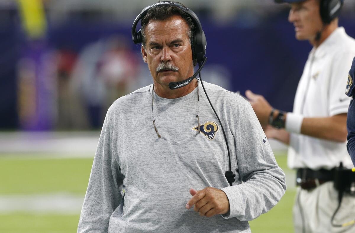 Coach Jeff Fisher works the sideline during the first half of the Rams' preseason game against the Minnesota Vikings on Thursday.