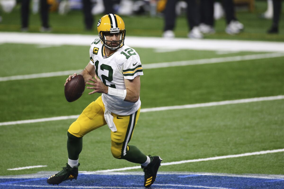 Green Bay Packers quarterback Aaron Rodgers looks to pass against Detroit Lions.