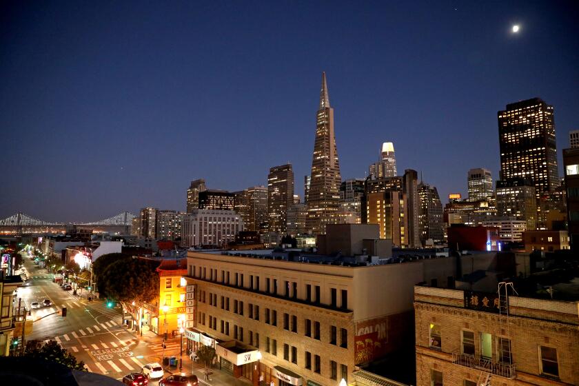 SAN FRANCISCO, CA - OCTOBER 14: The downtown skyline seen from the rooftop of China Live San Francisco, a 30,000 sq ft restaurant and market place, on Thursday, Oct. 14, 2021 in San Francisco, CA. China Live opened March 2017 and was founded by George Q. Chen, founder and chairman, who is also the executive chef. (Gary Coronado / Los Angeles Times)