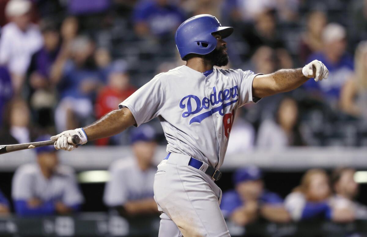 The Dodgers' Andrew Toles hits a grand slam against Colorado on Aug. 31.