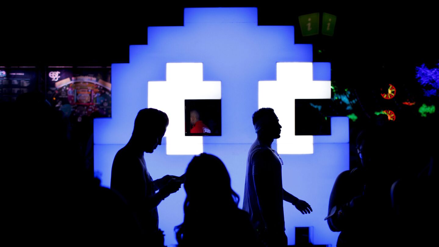 People walk past a Pac-Man installation during the Electric Daisy Carnival in Las Vegas on June 18.