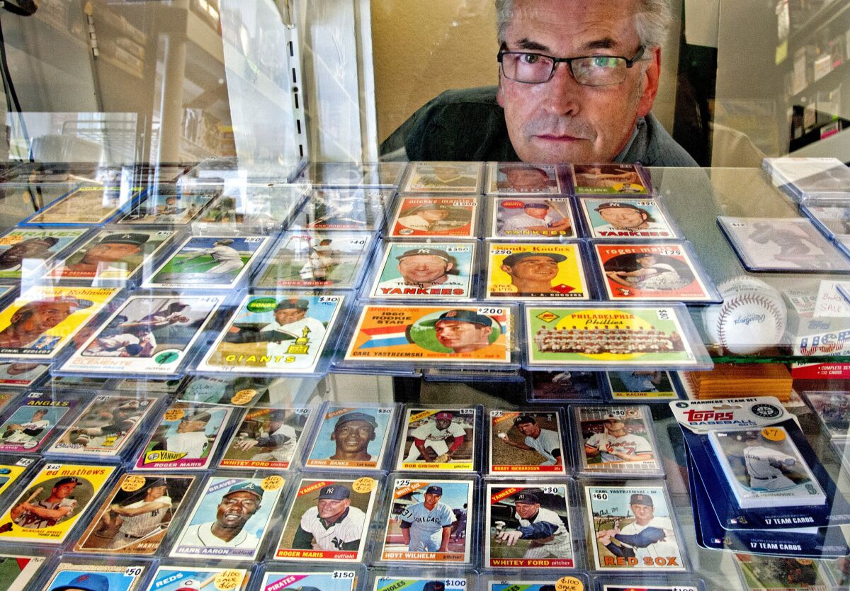 "It's like pulling the handle on a slot machine," Alan Bisson says of buying sports cards. "It's the chance of pulling the big one."