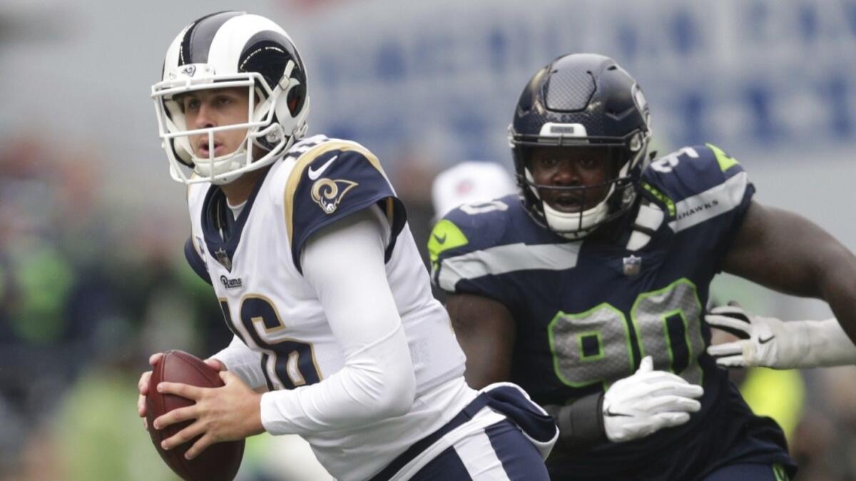 Rams quarterback Jared Goff scrambles against Seattle's Jarran Reed on Oct. 7.