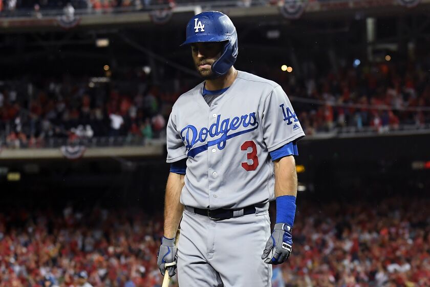 WASHINGTON D.C., OCTOBER 4, 2019-Dodgers Chris Taylor walks back to the dugout after striking out with the bases loaded against the Nationals in Game 4 of the NLDS at Nationals Stadium Monday. (Wally Skalij/Los Angeles Times)