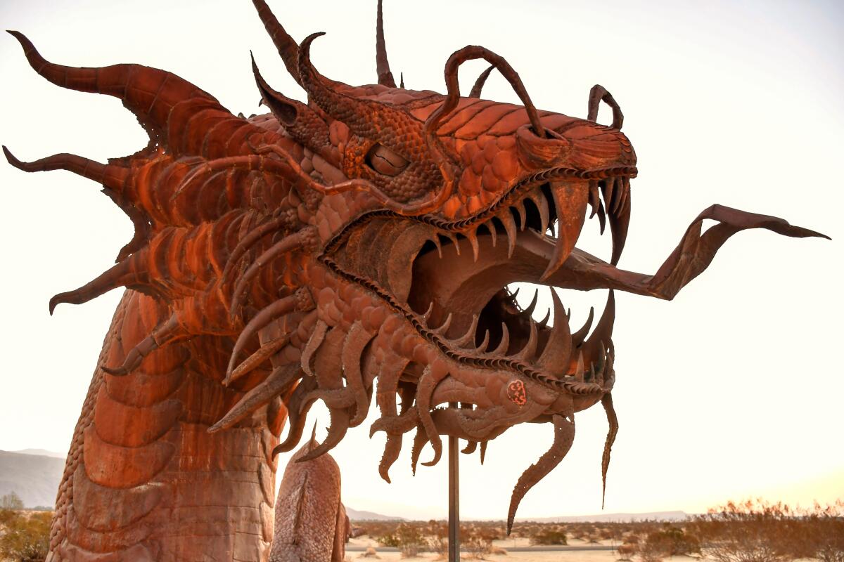 Head of metal dinosaur sculpture