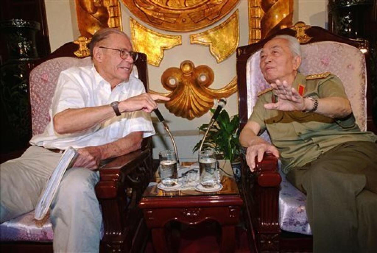 FILE - In this Monday, June 23, 1997, file photo, former U.S. Defense Secretary Robert McNamara, left, speaks to his onetime foe Gen. Vo Nguyen Giap in Hanoi, Vietnam. Officials say Giap, the military mastermind who drove the French and the Americans out of Vietnam, died at a Hanoi hospital Friday, Oct. 4, 2013, at age 102. He was the country's last famous communist revolutionary, and used ingenious guerrilla tactics to overcome enormous odds against superior forces. (AP Photo/Tri Hieu, File)