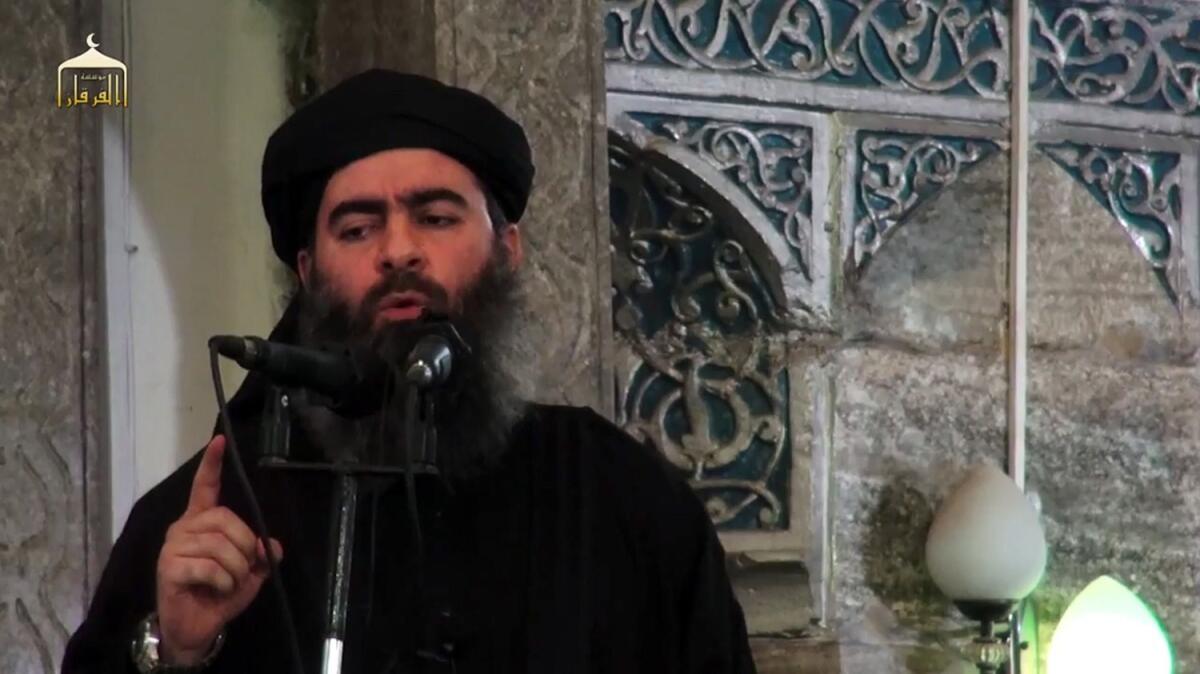 A man believed to be Abu Bakr Baghdadi, Islamic State's self-proclaimed leader, is shown in an image taken from a video released in 2014.