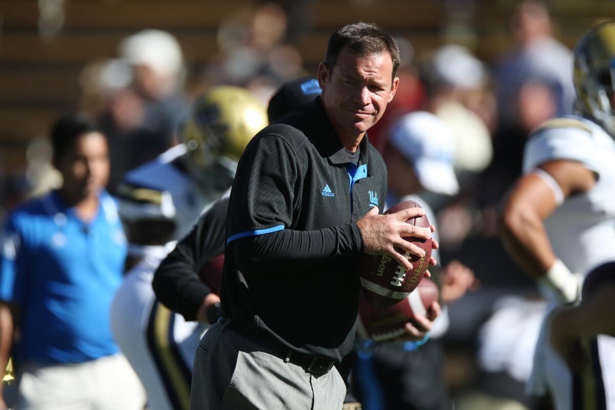 UCLA Coach Jim Mora takes part in drills before the Bruins face Colorado in Boulder on Oct 25.