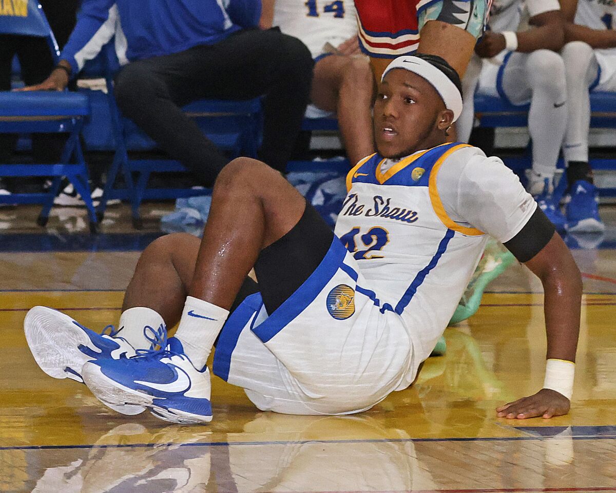 Senior point guard AJ Robinson crashes to the court during a game.